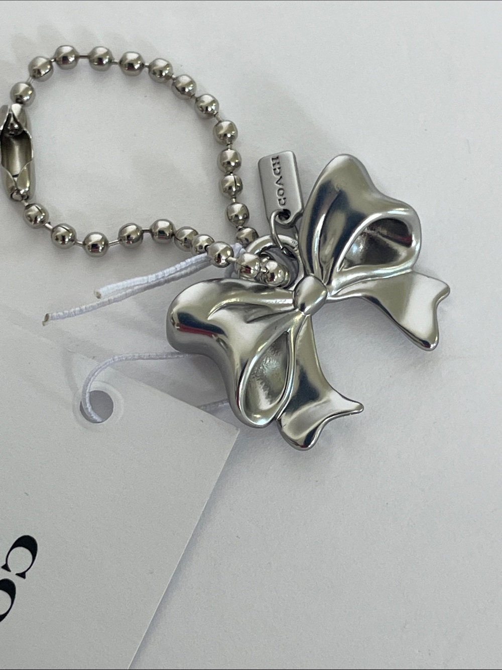 NWT Coach New York Exclusive Silver Bow Charm